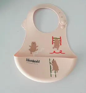 Silicone baby bib waterproof infant feeding bib with cute cartoon bear pattern detail.