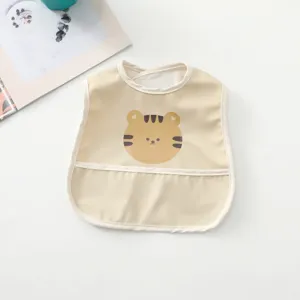 Waterproof baby bib with cute cartoon tiger design and catcher pocket, ideal for mealtime.