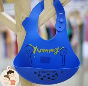 Blue silicone baby bib with crumb catcher pocket, waterproof and easy to clean for infants.