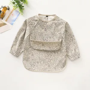 Waterproof long sleeve baby bib with cute grey dot pattern for clean feeding time.