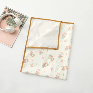 Waterproof baby diaper changing mat with cute cartoon bear pattern and brown border.