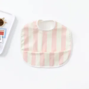 Close-up detail of cute pink and white striped baby waterproof bib with front pocket.