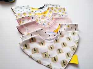 Cute cotton baby bandana bibs with cute cartoon prints, soft snap buttons for infants.