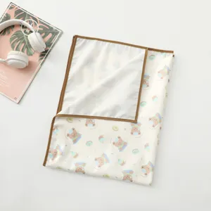 Waterproof baby urine pad with cute bear cartoon pattern, brown trim detail for infant care.