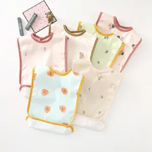 Waterproof baby feeding bibs with cute cartoon prints, lightweight infant toddler aprons.
