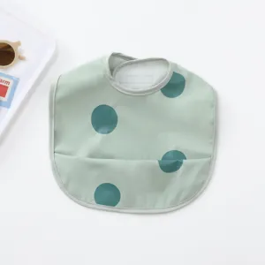 Waterproof baby bib with green polka dots, dining bib for toddlers with crumb catcher.