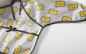 Waterproof baby long sleeve dining bib with cute yellow cookie pattern, easy to clean daily.