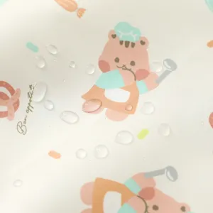 Close-up detail of waterproof baby mat surface, showing droplet resistance and cute bear print.