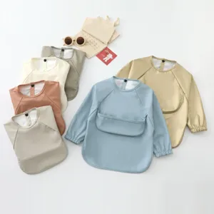 Waterproof baby long sleeve smock bib with catch-all pocket for feeding and toddler daily use.
