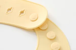 Silicone baby bib button detail view, soft waterproof feeding accessory for infants