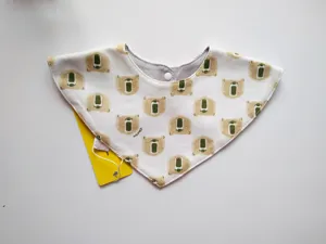 Cotton baby triangular bib with cute cartoon bear print and snap button detail, ideal for daily.