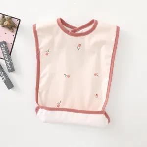 Waterproof baby bib with cute tulip print, sleeveless design and crumb catcher pocket for feeding.