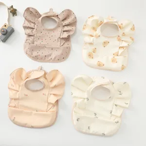 Waterproof baby bibs with cute angel wings and cartoon prints, ideal for feeding time.