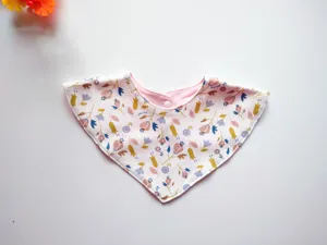 Baby cotton triangle bib detail, floral print fabric close-up, soft and skin-friendly texture.