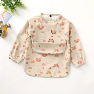 Baby waterproof long sleeve bib detail showing cute rainbow cloud pattern and front food pocket.