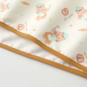 Cute cartoon waterproof baby urine pad detail, soft fabric with chef bear print, brown edge.