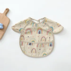 Waterproof baby long sleeve bib detailed view, cute rainbow pattern, soft polyurethane material.