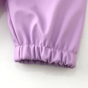 Close-up detail shot of children waterproof coverall elastic sleeve cuff in light purple.