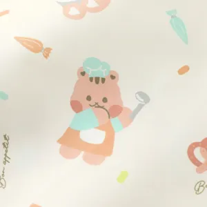 Detail view of cute cartoon bear print waterproof baby urine pad fabric, soft and breathable.