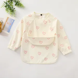 Baby long sleeve waterproof bib with cute heart pattern, soft feeding smock for toddlers.