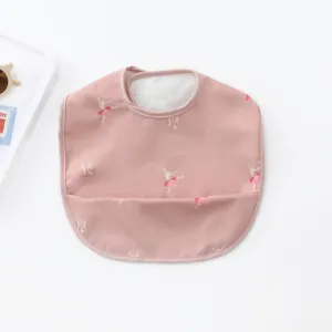 Waterproof pink baby bib with elegant ballerina print, soft PU material, perfect for feeding time.