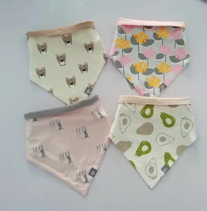 Cotton baby triangle bibs with cute cartoon prints and snap buttons for newborns infants.