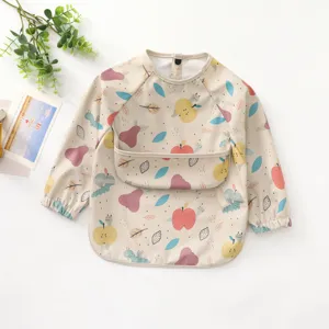 Baby long sleeve waterproof PU bib in cute beige fruit print. Perfect for mess-free feeding.