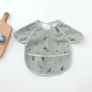 Waterproof baby bib with cute fruit print, soft PU smock for toddler mealtime feeding details.