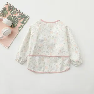 Cute floral bunny waterproof long sleeve baby art smock detail, pink trim, ideal for feeding.