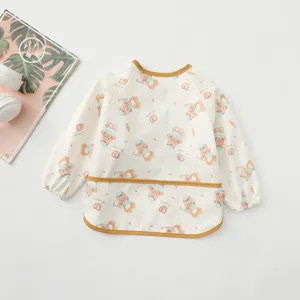 Waterproof baby long sleeve art smock detail view, featuring cute bear print and useful pocket.