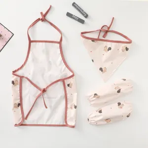 Waterproof baby toddler apron set detail view with cute squirrel pattern bib and sleeves.