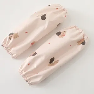 Waterproof kids oversleeves with cute squirrel print, pink arm sleeves for daily use.