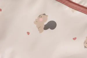 Cute squirrel print waterproof baby bib detail shot, soft safe material for feeding time.