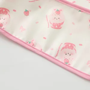 Waterproof baby art smock detail, pink trim, cute strawberry bunny graphic, soft fabric.