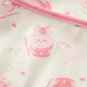 Waterproof baby art smock close-up detail, cute pink bunny cupcake print fabric texture.