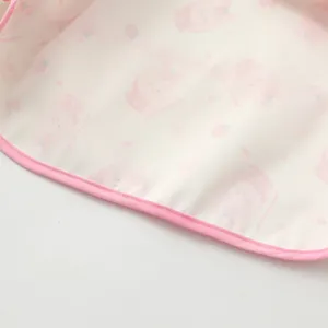 Kids waterproof smock detail, cute strawberry bear print fabric, pink trim, soft material.