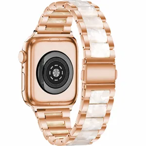 Rose gold metal and white resin replacement strap detail for Apple Watch 44mm series.