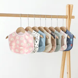 Waterproof baby PU bibs with crumb catcher pocket, cute assorted patterns for toddlers feeding.