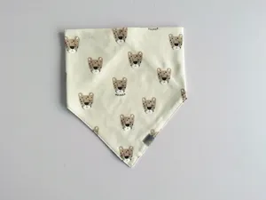 Cute cotton baby bandana bib with cartoon leopard print and snap closure, soft and skin-friendly.