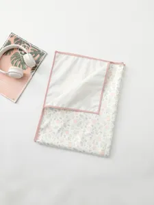 Korean style waterproof baby urine pad with cute cartoon floral print and pink trim.