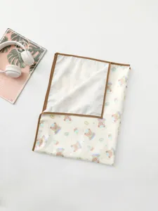 Waterproof baby urine mat with cute cartoon bear pattern, soft infant changing pad.