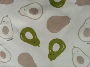 Soft cute avocado print cotton baby bib fabric closeup detail shot for newborn infant use