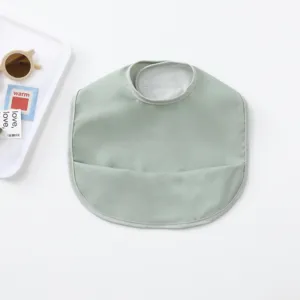 Waterproof baby PU feeding bib with crumb catcher pocket, soft and easy clean toddler apron.