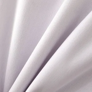 Close-up detail shot of smooth waterproof fabric texture with soft natural draping folds.