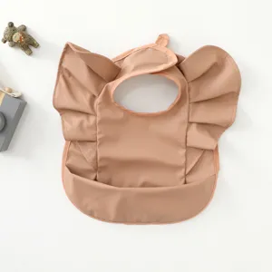 Waterproof baby bib detail shot, PU material, cute angel wings design, ideal for feeding.