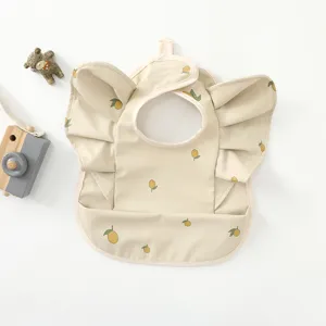 Cute waterproof baby bib detail with adorable angel wings ruffles and lemon print pattern.