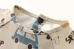 Detailed view of baby waterproof long sleeve PU feeding bib collar with cute car print designs.
