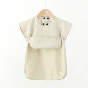 Detail view of the soft PU baby eating bib short sleeve waterproof design for clean feeding.