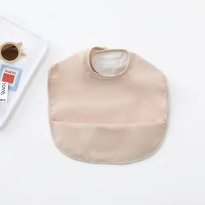 Waterproof baby bib in light pink PU material with crumb catcher pocket for feeding time clean.