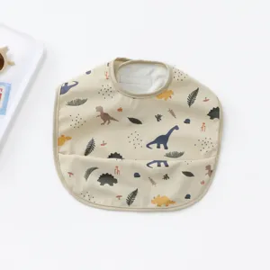 Danish style PU waterproof baby bib with cute dinosaur print and crumb catcher pocket main view.